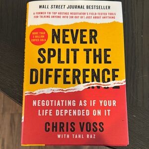 Never Split the Difference by Chris Voss - Red and Yellow Cover